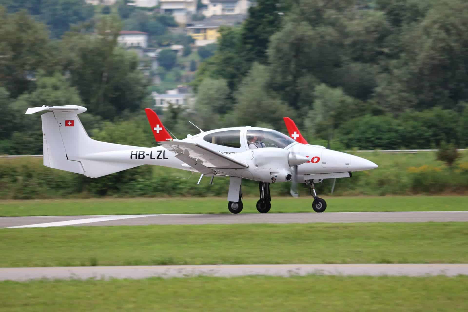 Diamond DA42 twin-engine aircraft in flight, Aelo Swiss Academy training fleet.